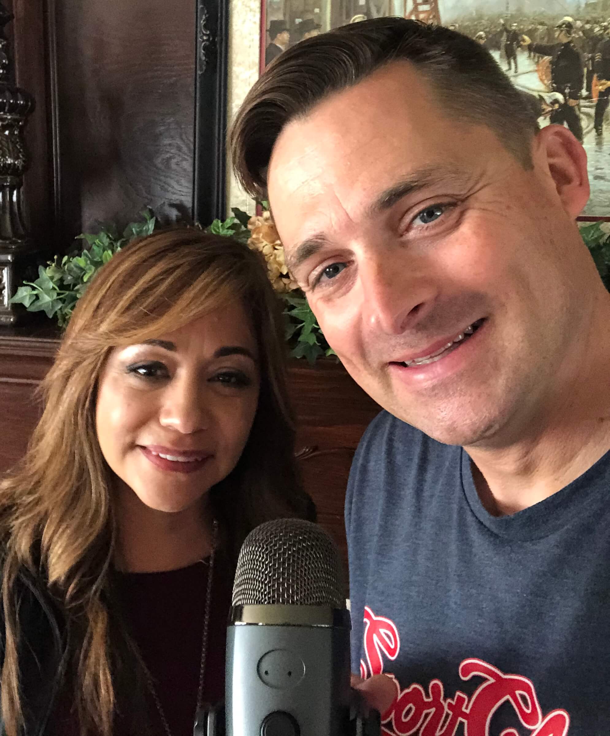 Chad Jordan and Barbara Montes holding a microphone